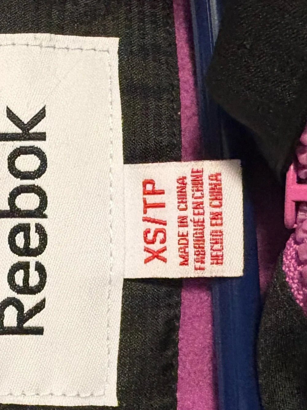 XS Reebok Women’s Black Jacket with Purple Trim Hooded Windbreaker - Picture 3 of 5